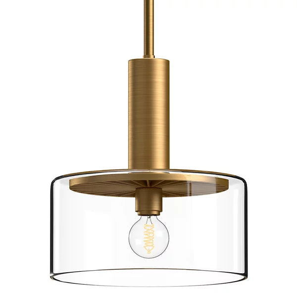 Royale pendant light in a gold finish featuring a cylindrical body, decorative radiating disk, and clear glass drum shade for upscale hospitality interiors.