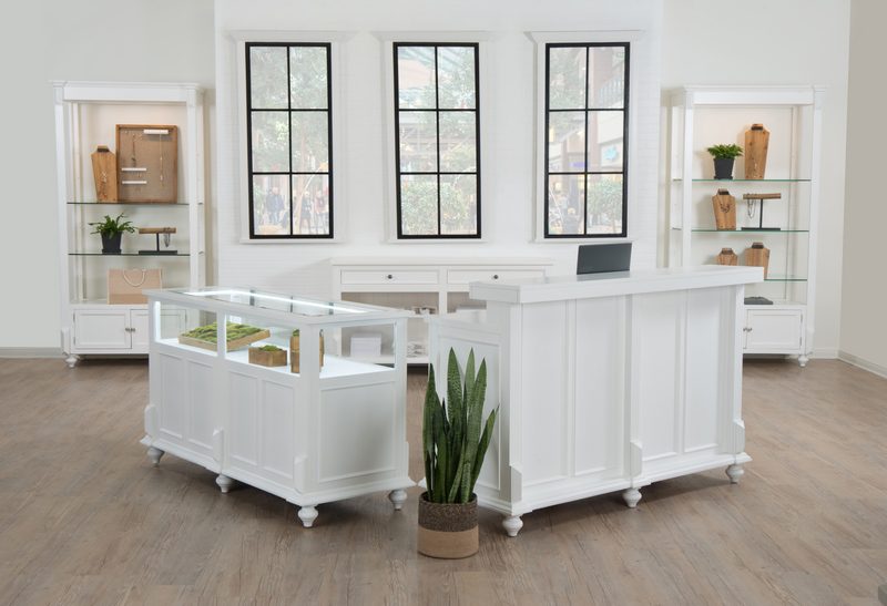 Front view of the Vintage Back Cash Wrap in a white painted finish, showing the countertop and adjustable shelves used for retail checkout and packaging tasks.
