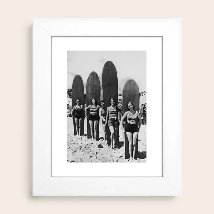 Woman Surfers black and white beach photography print by Vintage Vivian in white hardwood frame, ideal for minimal or coastal décor