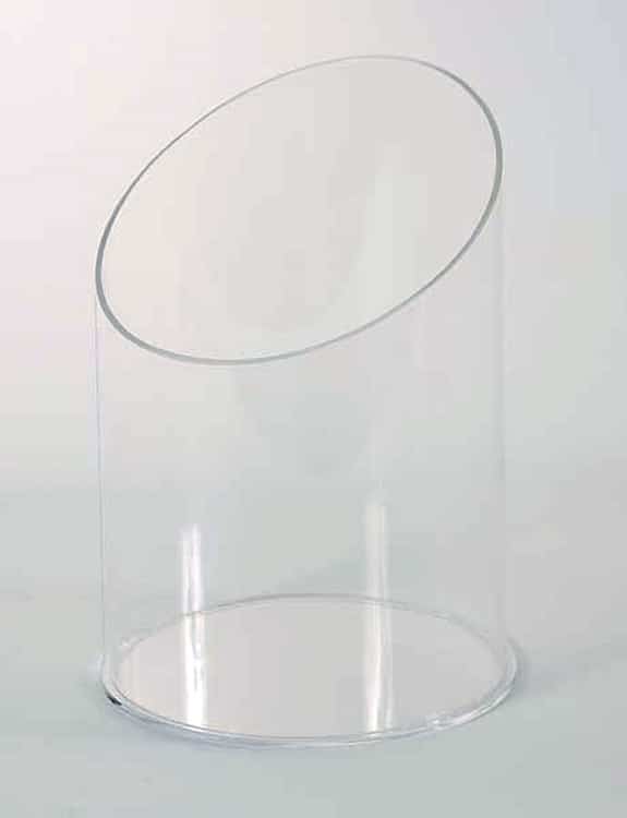 Front view of a clear angle-cut acrylic canister showing the slanted open top used for displaying candy and small packaged products.