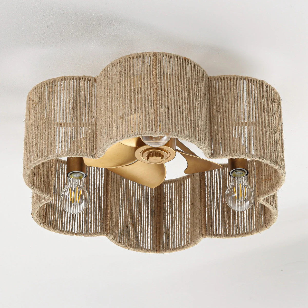 Flush-mount rattan ceiling fan with antique gold finish and LED light for cafés and bedrooms