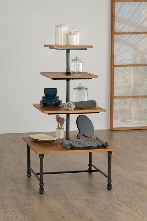 Front view of a 4-tier square display table shown with a sturdy metal base and pine wood tiers, designed for multi-level merchandising in retail and hospitality environments.