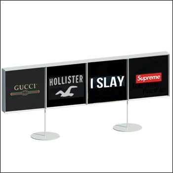Metal t-shirt display box with stand in raw steel finish, four-wide design for showcasing apparel.