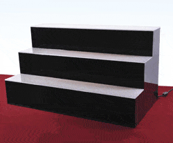 Three-tier acrylic back bar display with black base and white step tops designed to hold multiple liquor bottles