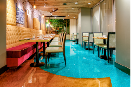 Modern restaurant with unique brown and blue flooring.
