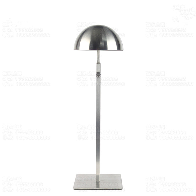 Adjustable brushed steel hat display stand with round base and vertical post.