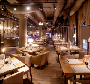 Long dining table with chairs in a restaurant setting
