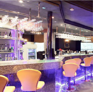 Modern bar interior with chairs and shelves in a stylish setting