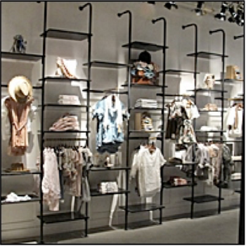 Clothing store display with mannequins and shelves in a retail setting