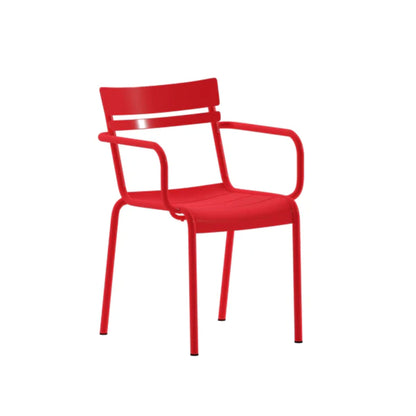 Angled view of red steel arm chair showing two-slat back, slatted seat, and stackable frame.