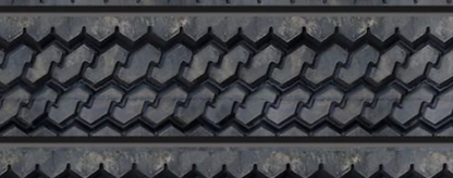 Close-up view of textured tire tread wall panel showing detailed repeating tread design.