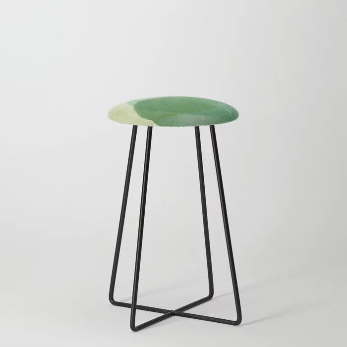 Abstract Organic Watercolor Shapes in Green Counter Stool by Apricot-Birch with black steel legs – artistic seating for hotel lounges, restaurants, and café interiors