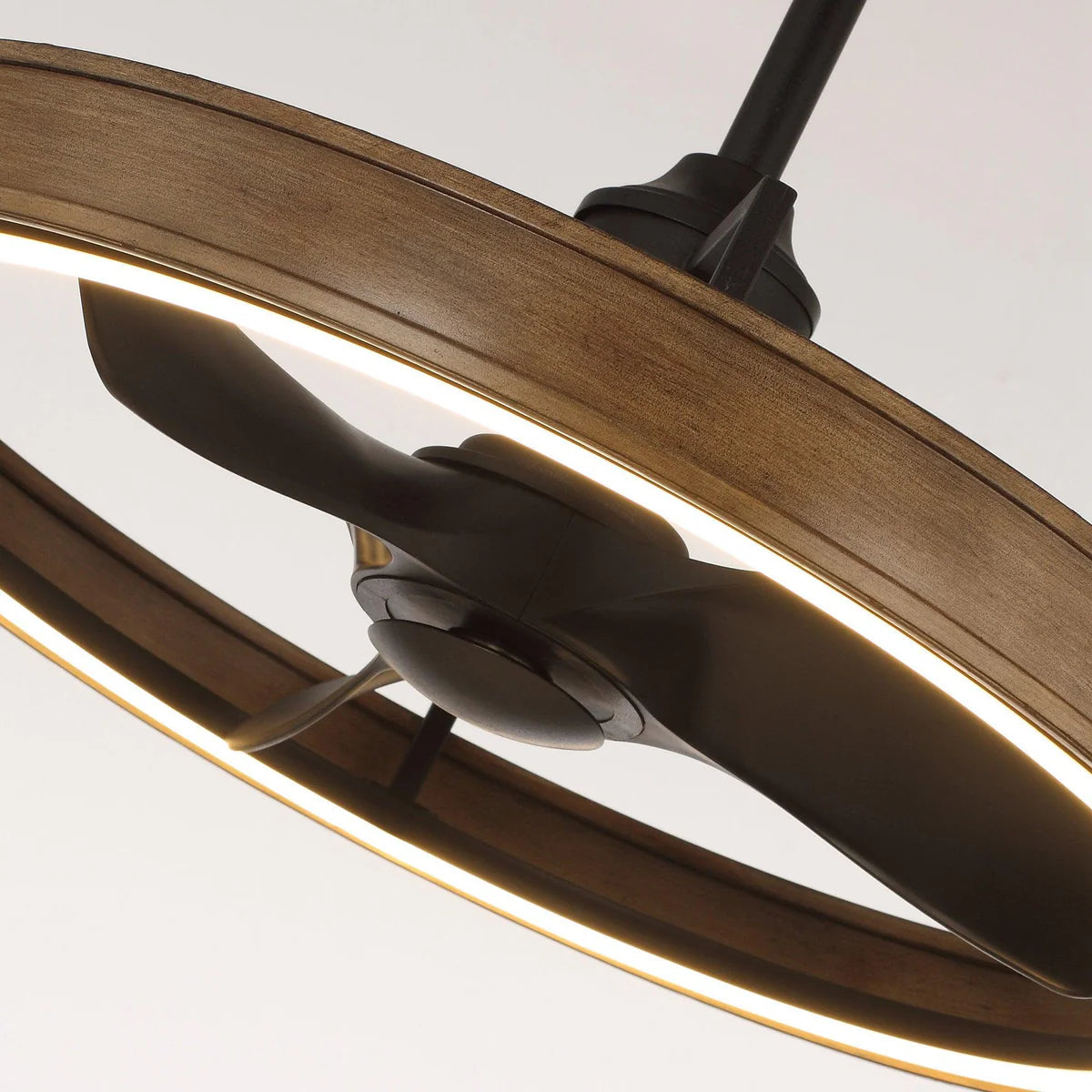 Rustic brown industrial ceiling fan with open cage design and reversible black blades