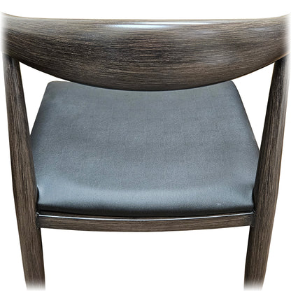 Rear view of Elbow Chair featuring driftwood faux wood finish and black vinyl seat. Commercial-grade seating ideal for cafés, restaurants, and lounges.