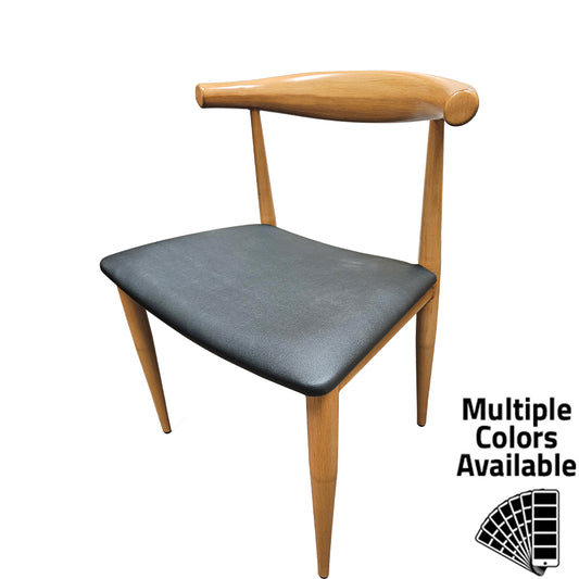 Elbow Chair with metal frame in natural clear coat faux wood finish and black vinyl seat. Durable indoor dining chair with non-marring glides and modern curved back design.