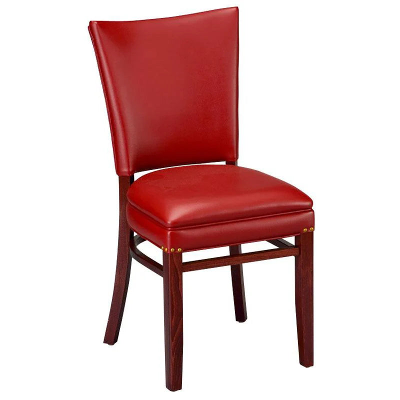 Justin upholstered beech wood dining chair in medium walnut finish with cream vinyl seat and decorative nail trim. Custom wood stains and upholstery colors available. Made in the USA for restaurant and hospitality interiors.