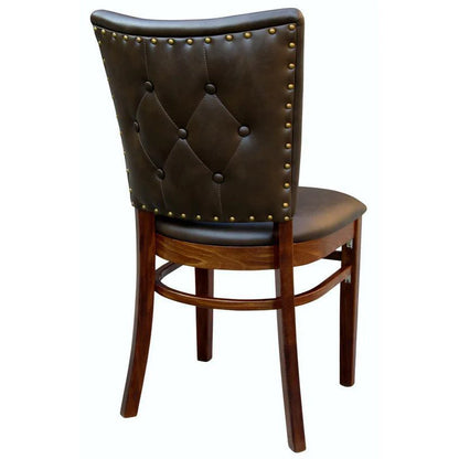 Rear view of the Lima upholstered beech wood chair showing solid beech wood frame and decorative nail trim along the backrest. Finished in walnut wood stain with cream vinyl upholstery. Made in the USA.