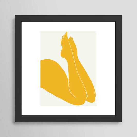 Nude in Yellow 3 art print in black frame displayed in restaurant dining area