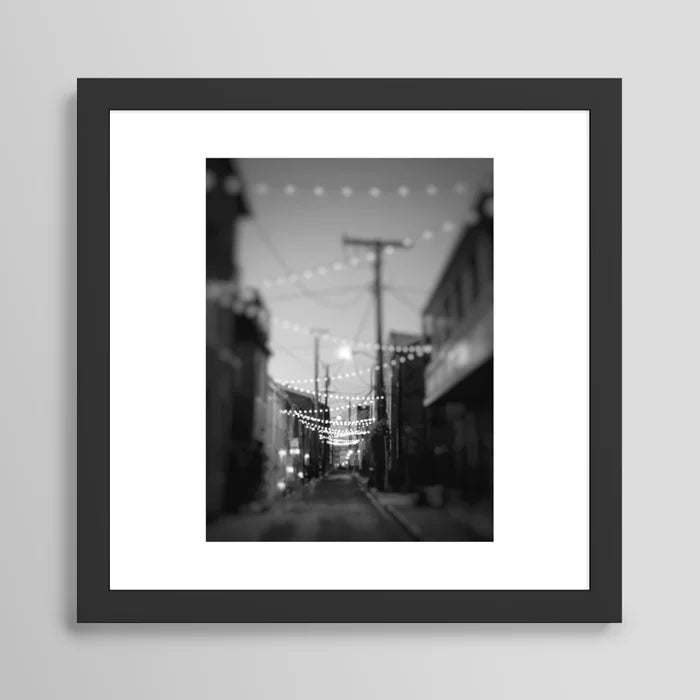 Party Lights in the City Baltimore Maryland Art Print in black frame – sleek modern cityscape wall art ideal for restaurant lounges, hotel bars, and urban cafés