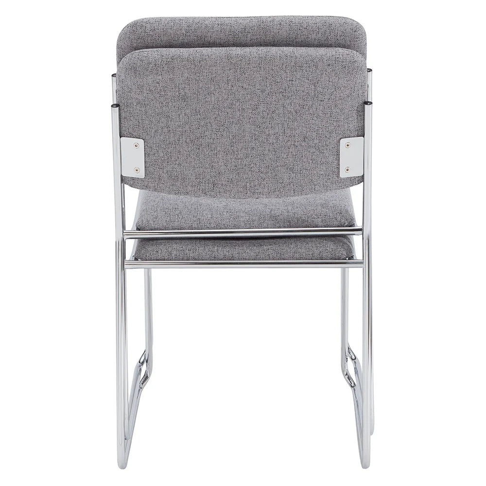 Stack of gray fabric side chairs with silver steel frames, lightweight and space-saving design for conference rooms and event seating.