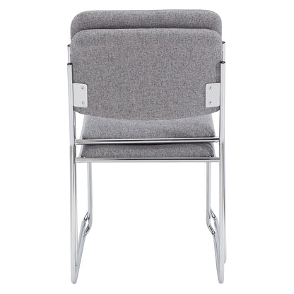Stack of gray fabric side chairs with silver steel frames, lightweight and space-saving design for conference rooms and event seating.