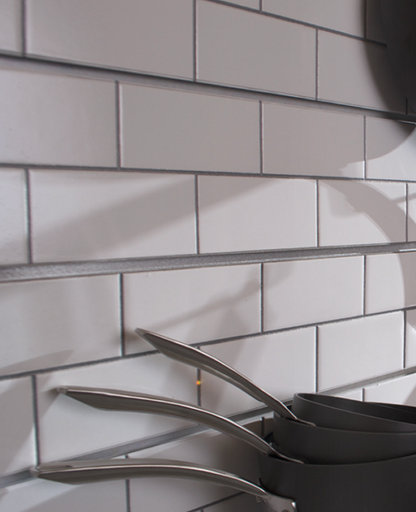 Faux subway tile wall panels installed in a commercial interior, creating a clean modern surface for restaurants, bars, or cafés.