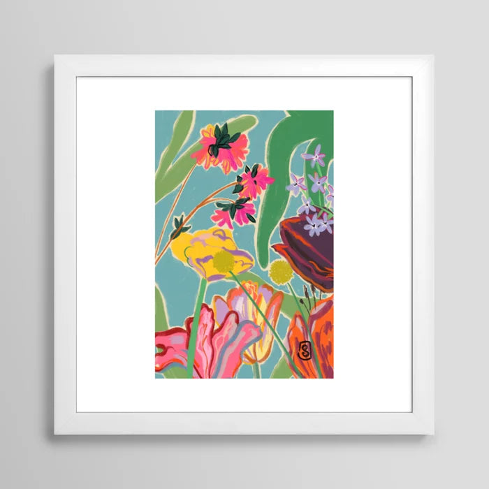 Sunny Landscape art print in white frame showcased in café seating area