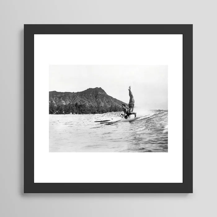 Surfing Diamond Head, Hawaii Art Print by Vintage Surf Photos framed in black wood – vintage surf photography wall art featuring Waikiki beach and Diamond Head in Hawaii