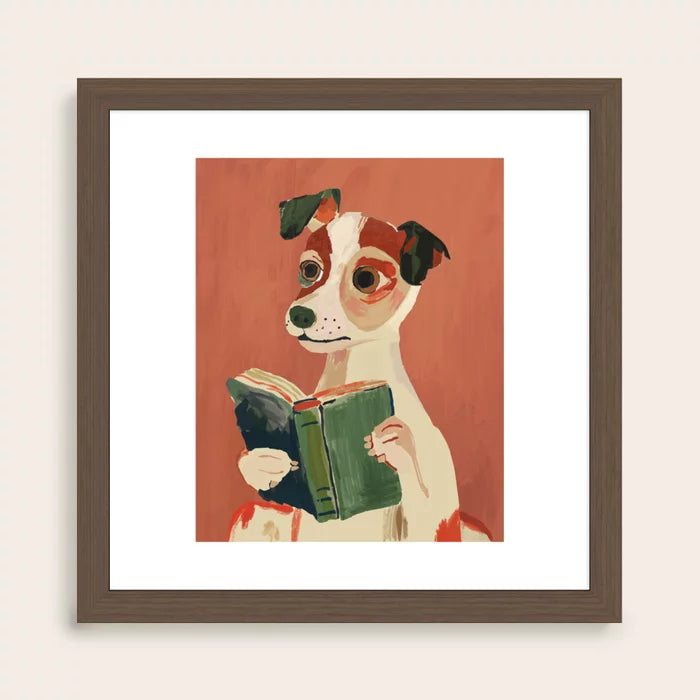 walnut framed artwork of a dog reading a book on a red background