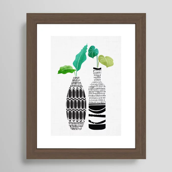 Modern tropical art with tribal vase design framed in rich walnut finish