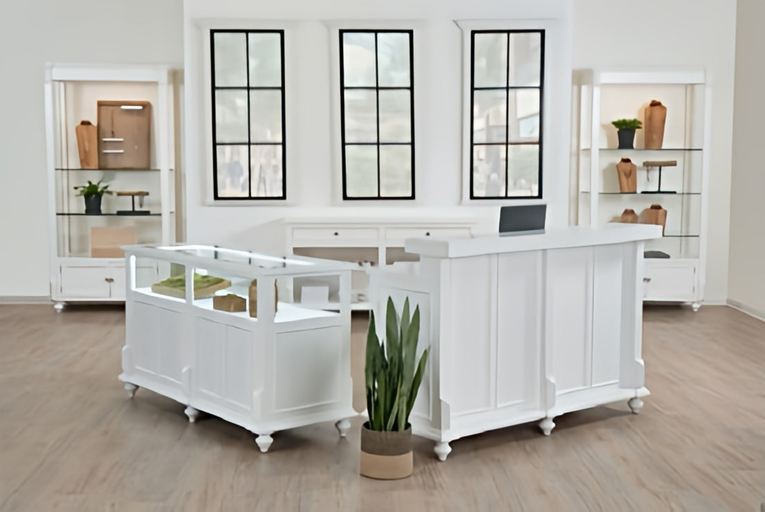 White reception desk with glass front in a modern office setting